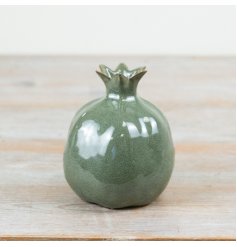 Elevate your decor with this chic ceramic pomegranate, adding stylish and elegant charm to any space.