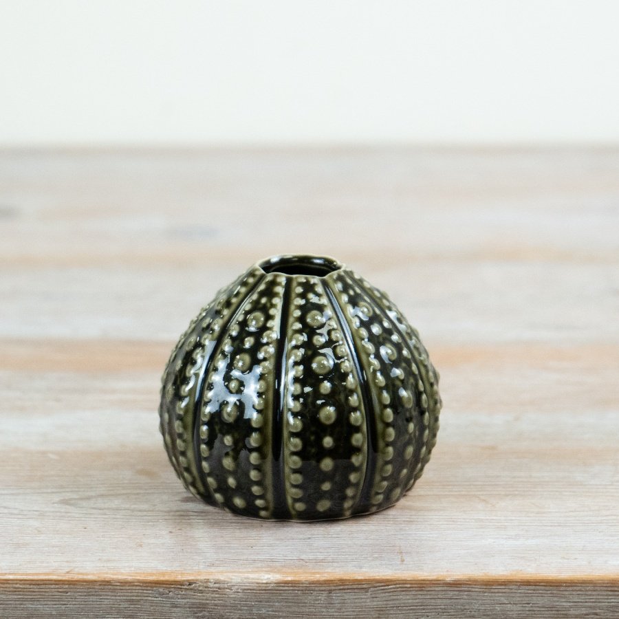 Bring ocean charm to your decor with this dark green sea urchin-inspired vase.