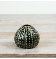 Add oceanic elegance to your space with this dark green sea urchin vase