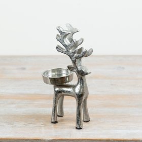 A candle holder designed as a standing reindeer figure.