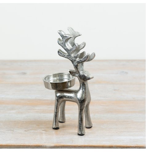 Candle holder designed as a standing reindeer for festive decor.