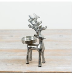 Candle holder designed like a standing reindeer for festive decor.