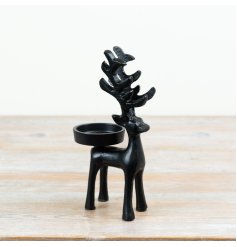 Tall black candle holder for elegant decor and stable candle display.