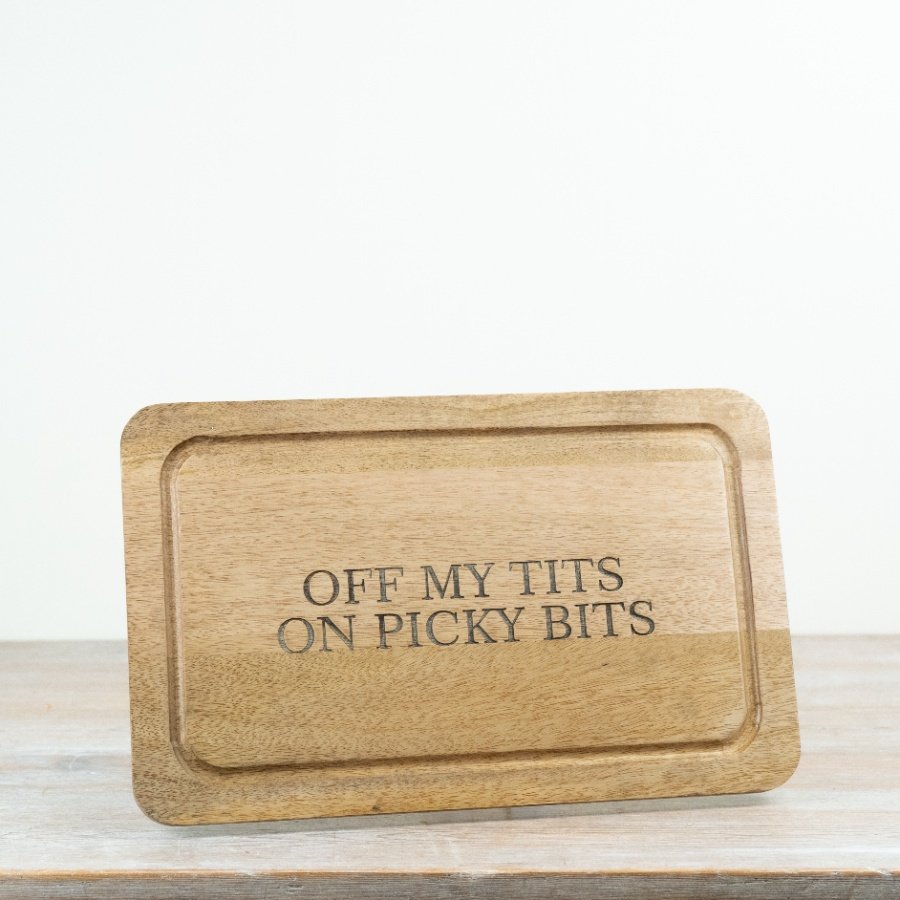 Handcrafted wooden serving board with a rustic charm.