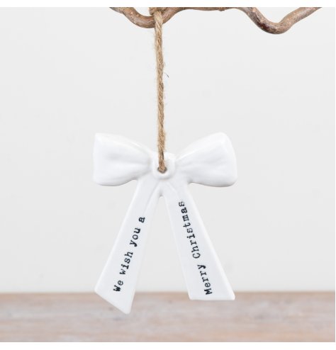 Perfect for tree decor, this "We Wish You A Merry Christmas" hanging bow adds festive cheer.
