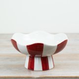 Add a playful yet sophisticated touch to seasonal collections with this Red & White Striped Pedestal Bowl.
