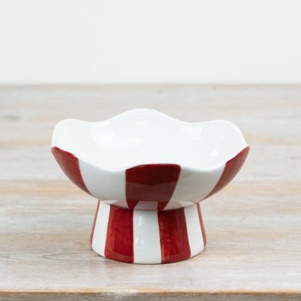 Bring holiday joy to your space with our red and white striped candy bowl.