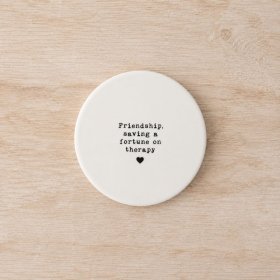 Delightful round coaster celebrating friendship charm.