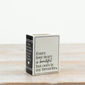 Add a romantic, sentiment-led piece to your collection with this ceramic book-style vase.