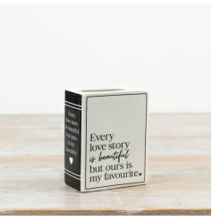 This compact ceramic book vase blends romantic messaging with a timeless monochrome palette. 