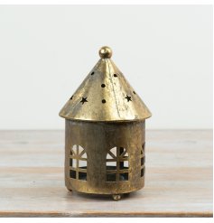 Enjoy a cosy, welcoming glow with this delightful metal house candle holder.