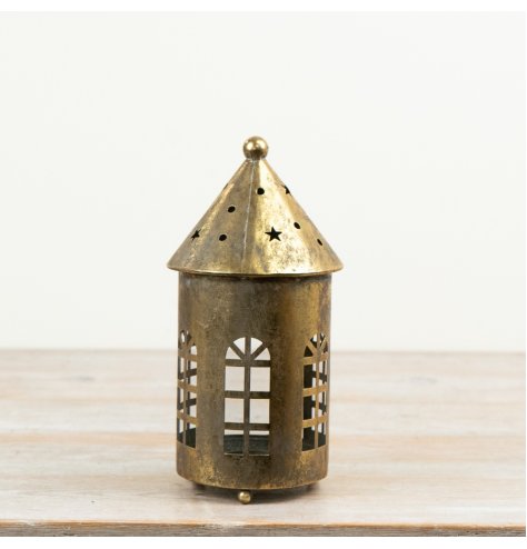 Bring a warm, golden glow to your space with this elegant gold candle holder.