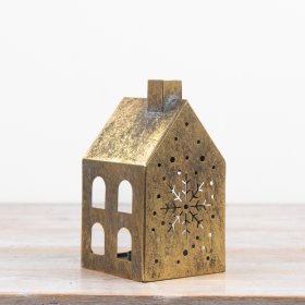 Add a warm, atmospheric glow to festive interiors with this antique gold house candle holder.