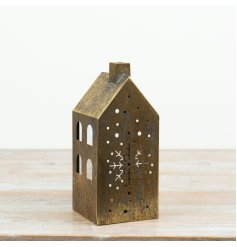 Add a warm, atmospheric glow to festive interiors with this antique gold house candle holder.