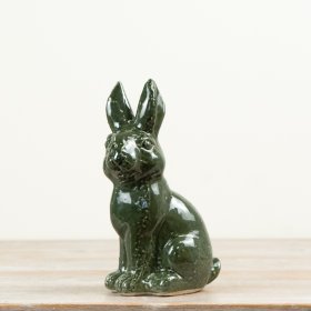 Add charm and light with this delightful Green Ceramic Rabbit décor piece.