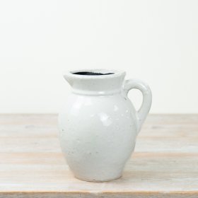Timeless white ceramic jug vase, ideal for fresh blooms or elegant home decor accents.