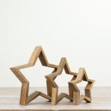 Enhance your decor with this set of 3 mango wood open stars, adding natural texture and sculptural charm.
