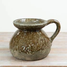 Add organic charm and rustic flair to your decor with this handcrafted Rustic Glazed Ceramic Jug.