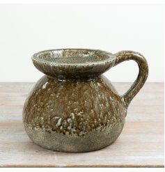 Add organic texture and artisan charm to your collection with this Rustic Glazed Ceramic Jug.