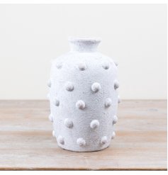 Adorable cement bobble vase with a playful design.