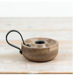 Add a touch of rustic charm and warmth to any room with this elegant candle stand
