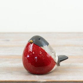 a delightful robin decoration with rustic black and red glaze