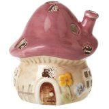 Add a whimsical touch to your space with this Pink Ceramic Mushroom House