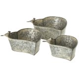 Add a charming touch to any space with this set of three elegant metal heart-shaped planters