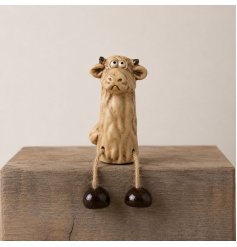 Charming Highland cow with expressive eyes and a textured ceramic finish