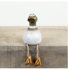 a delightful duck figurine with quirky dangling legs perfect for display
