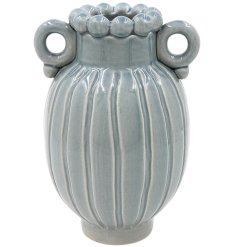 Blue glazed vase featuring a fluted design, looped handles, and a beaded decorative rim.