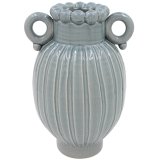 A sleek blue vase finished with a clear vase and a beaded pattern around the rim.