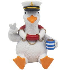 Bring coastal charm with this Seagull holding a teacup ornament, perfect for any space.