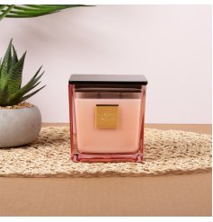 Enjoy the soft glow and gentle scent of the Rouge Candle.
