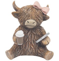 Bring charm to your space with the Coffeeholic Highland Cow Ornament.