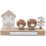 Add warmth and rustic charm to your home with the "Home Is Where The Herd Is" Highland Cows Plaque