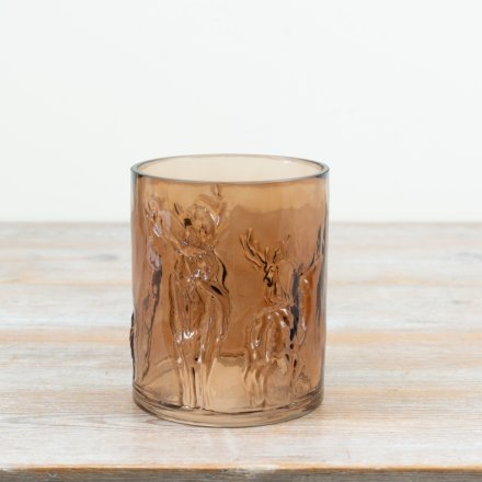 Embrace seasonal warmth with this artisan glass reindeer candle holder in rich brown tones