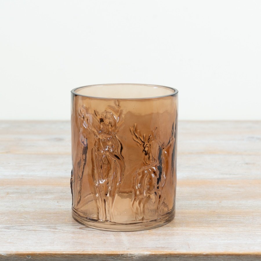 Embrace seasonal warmth with this beautifully crafted brown glass reindeer candle holder