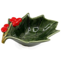 Bring holiday cheer to your table with this charming holly-themed bowl.