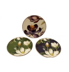 Bring vintage flair to your table with this charming floral enamel plate.