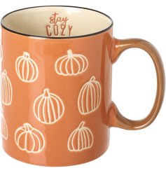 Embrace autumn with the Stay Cozy Pumpkin Mug—charming ceramic design