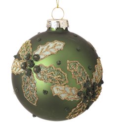 Add festive charm with this Green Bauble adorned with delicate floral designs
