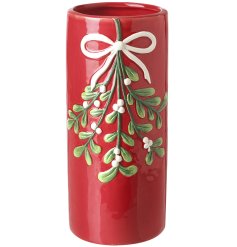 Bring holiday cheer with this lovely red ceramic pot.