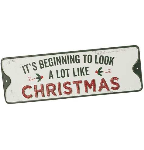 Bring holiday joy to your space with the "It's Beginning" metal sign decoration.