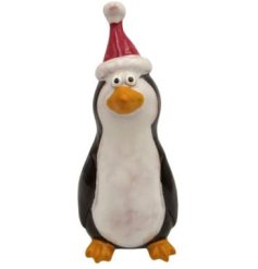 Endearing black and white penguin adorned with a vibrant red Santa hat