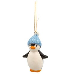 Delightful little penguin wearing a cosy blue hat, perfect for adding cheer