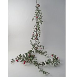 Rich green garland embellished with classic red berries and natural pinecones for enduring festive appeal