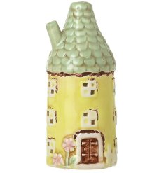 Add a cheerful charm to your home with this bright yellow ceramic round house ornament