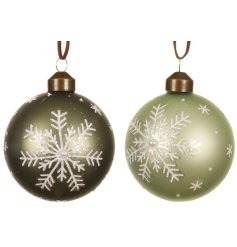 Add serene, nature-inspired charm to your decor with this elegant set of frosted green glass baubles.