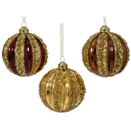 Craft a festive glow with this elegant collection of ribbed glass ornaments.
